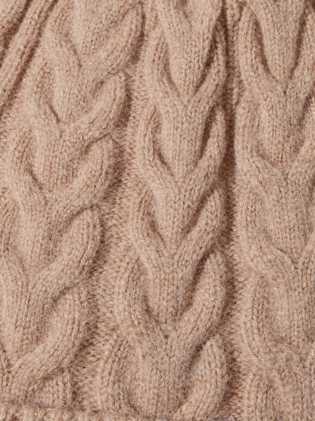 Close up of the cable knit on the wool hat, twisted leaf columns of pure wool
