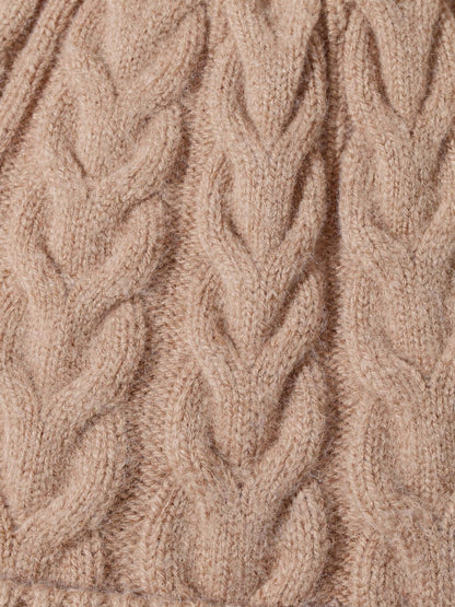 Close up of the cable knit on the wool hat, twisted leaf columns of pure wool