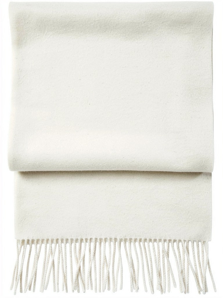 Chalk wool pashmina shawl folded flat, off-white brushed wool with twisted tassels