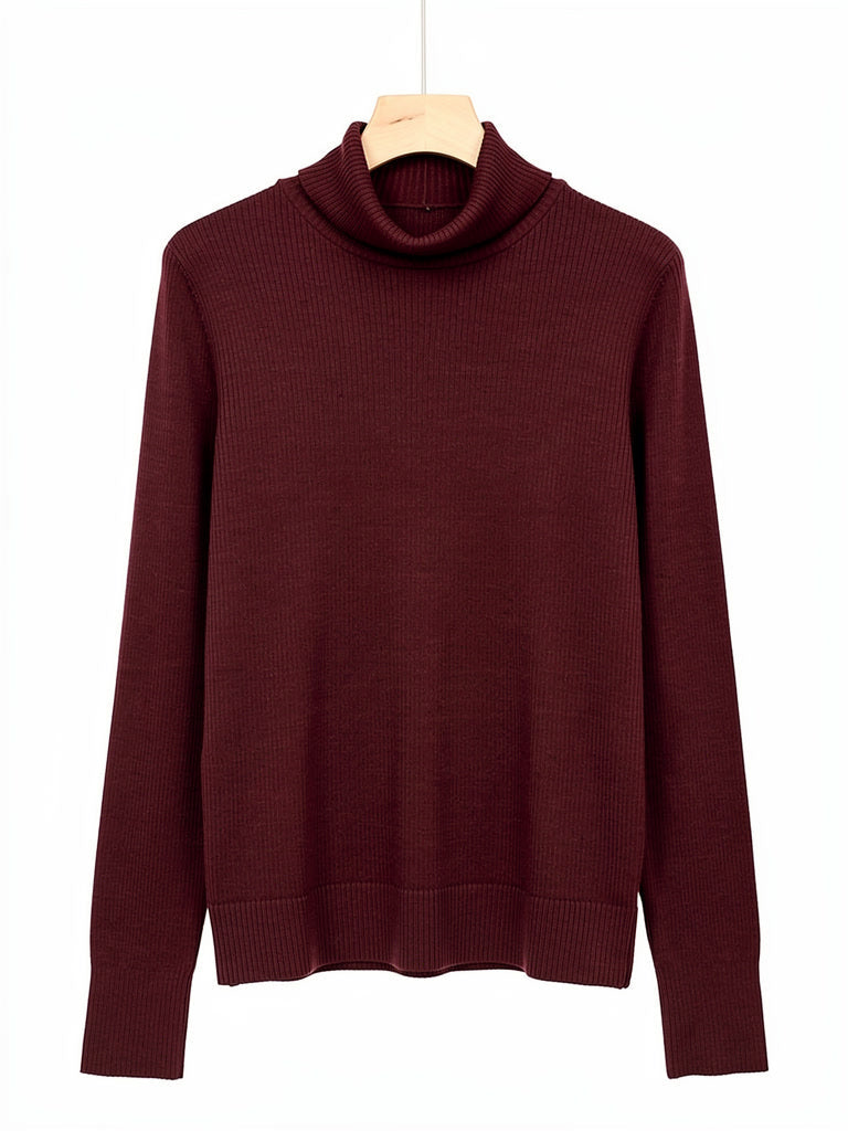 Burgundy wool roll neck jumper on a hanger, showing the fine rib, folded roll neck and deep ribbed cuffs