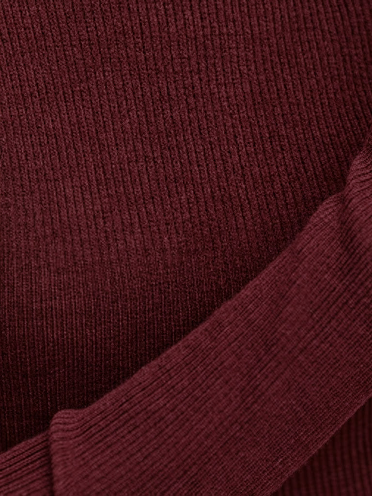 Close-up of the fine vertical rib of the burgundy wool roll neck jumper