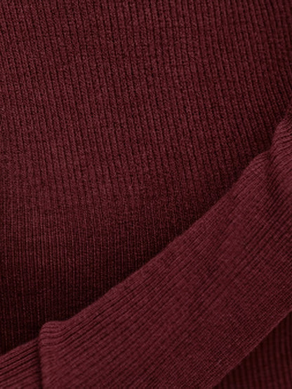 Close-up of the fine vertical rib of the burgundy wool roll neck jumper