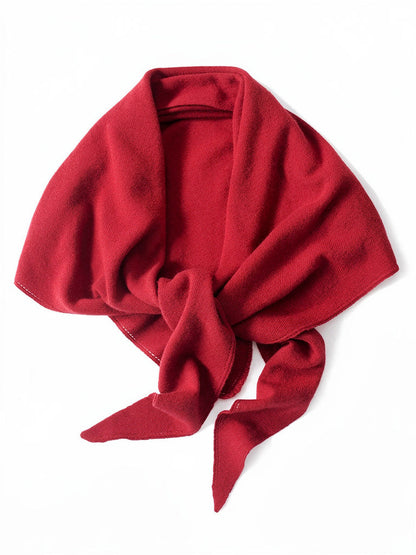 Knitted wool triangle scarf in Redcurrant, a deep berry red, shown against a white background