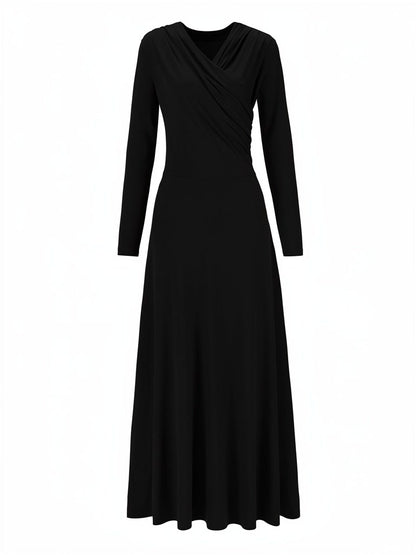 Wrap dress in black seen from the front, showing the crossed over V neck and the floor length skirt