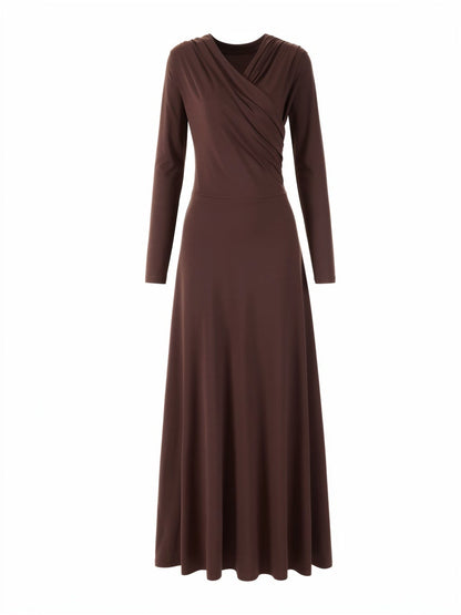 Wrap dress in cherrywood brown seen from the front, showing the crossed over V neck and the floor length skirt