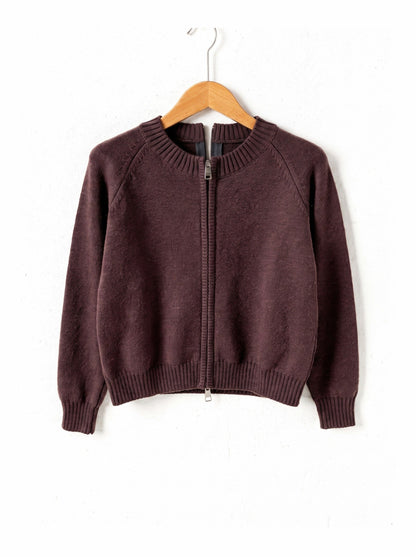 Cotton-rich zip-through cardigan in Cordovan brown on a plain wooden hanger