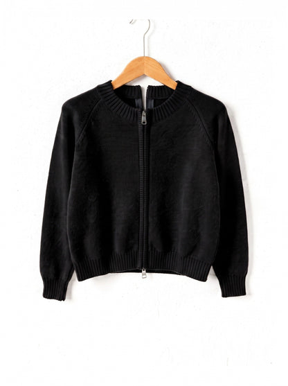 Zip-through cardigan in Liquorice black on a plain wooden hanger