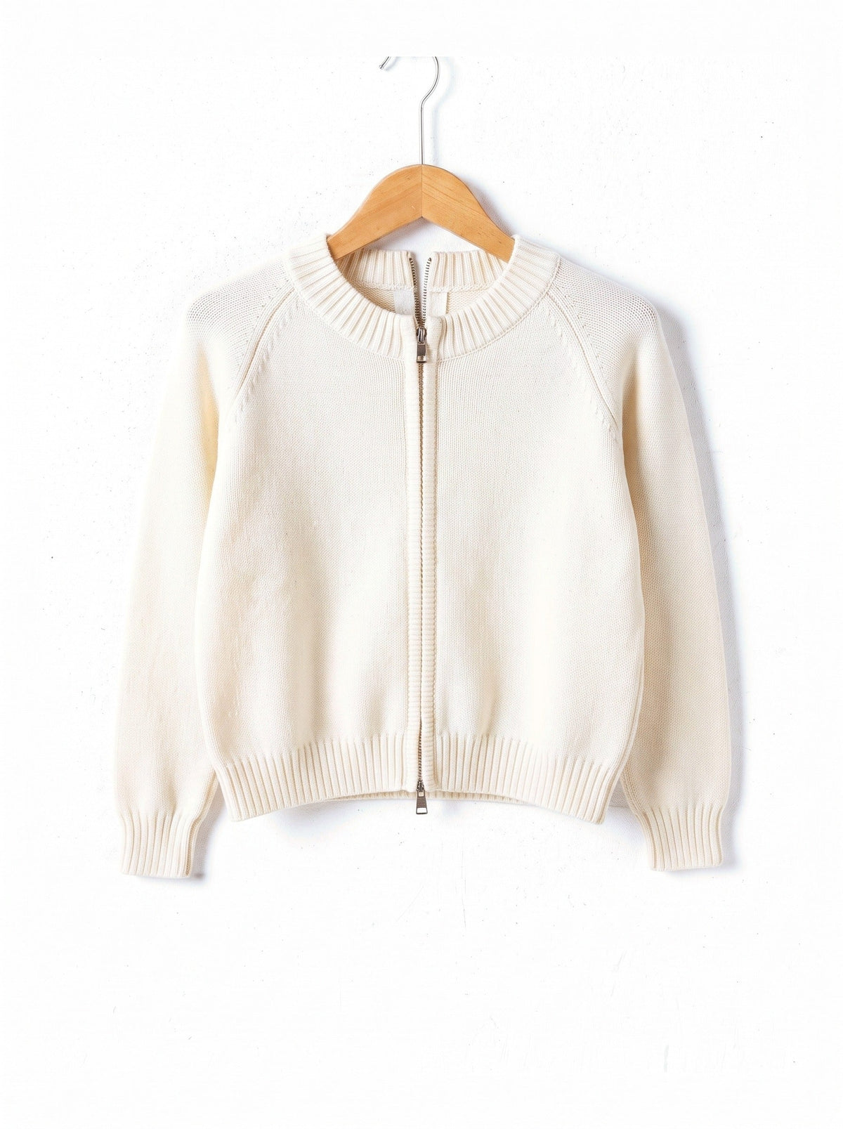 Zip-through cardigan in Whitewash white on a plain wooden hanger